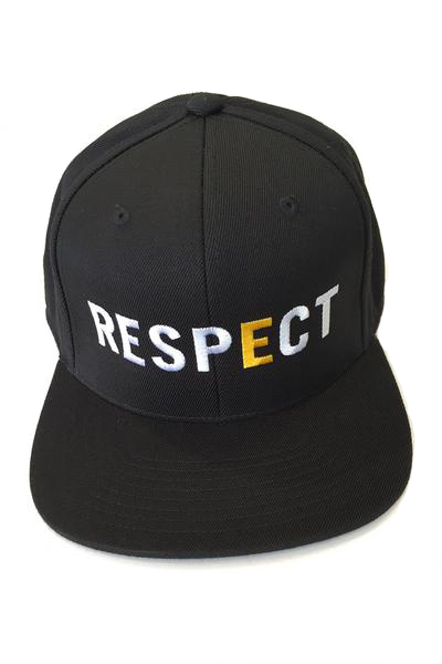 RESPECT Snapback: A black snapback hat with the world RESPECT written across the front in large capitol white letters, and a golden "E."