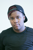 National Student Council leader Miguel Washington proudly wears the RESPECT Snapback: A black snapback hat with the world RESPECT written across the front in large capitol white letters, and a golden "E," backwards.